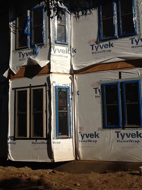 Windgate Alliance New Construction Vinyl Windows With Tan Exterior On