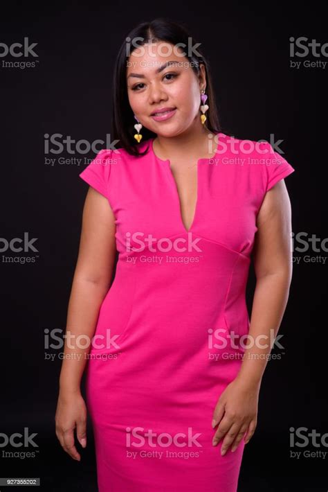 Beautiful Plus Size Woman Model Against Black Background Stock Photo