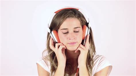 Headphones and earbuds can both cause hearing damage, but you have the power to reduce your risk of hearing loss. Beautiful Girl Wearing Headphones, Listening To Music And ...