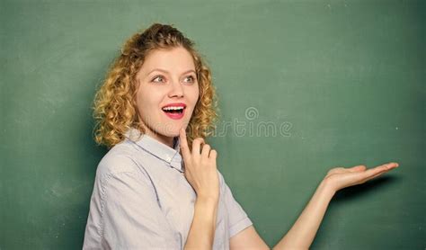 Woman Teacher In Front Of Chalkboard Teacher Explain Hard Topic