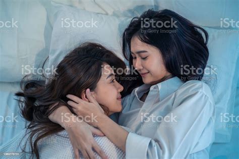 Asian Beautiful Lesbian Couple Lying Down On Bed And Hugging Each Other Attractive Romantic Girl