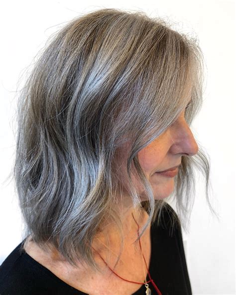 Going from colored hair to natural gray requires a transition stage that can be made a little less noticeable by how to grow out gray hair. How This Woman Transitioned From Brown to Natural Gray ...