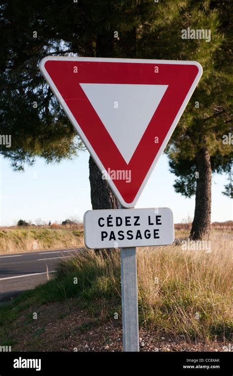 A French Road Sign Warning Drivers To Give Way When Joining A Main Road