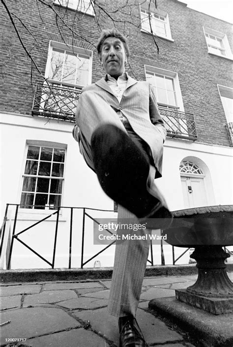 Comedian And Comic Acto Frankie Howerd Lifting His Foot Over The