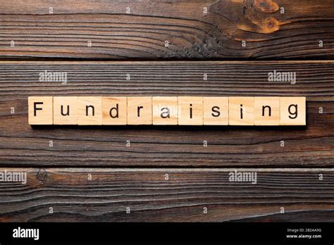 Fundraising Word Written On Wood Block Fundraising Text On Table