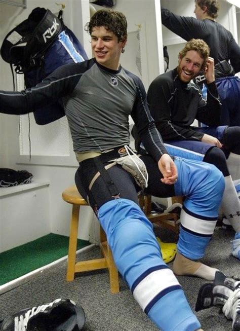hockey player wearing cup jock in locker room athletic body athletic gear hockey cup sports