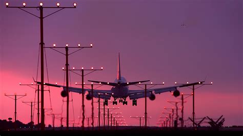 Download Wallpaper 2048x1152 Aircraft Landing Sunset Dual Wide