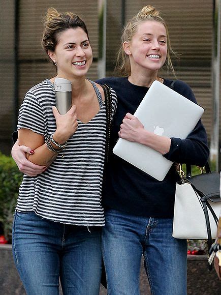 Amber Heard Laughs With Friend While Leaving Legal Meeting