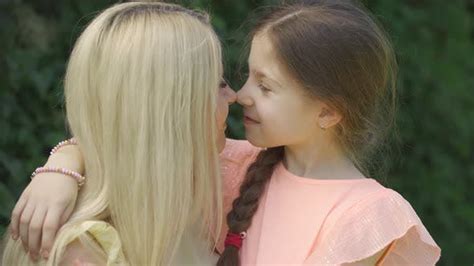 Portrait Of Mom Kissing Her Little Daughter Stock Footage Videohive