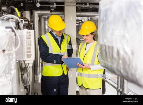 Engineers Working In Temperature Control Room Stock Photo Alamy
