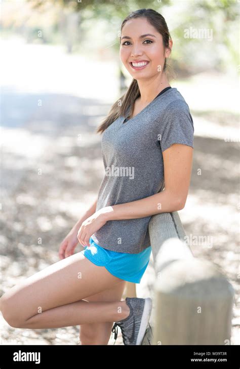 Female Outdoor Posing On Fence Fitness Stock Photo Alamy