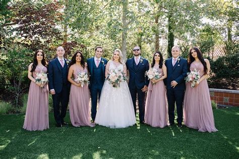 A Bride And Groom With Their Bridal Party