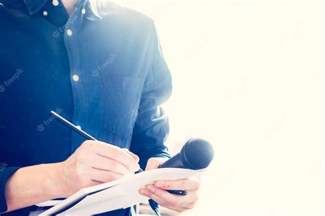 Premium Photo Male Journalist At News Conference Holding Microphone