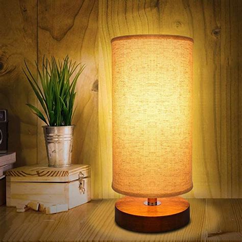 This is because they will consistently produce some great lighting which is useful and can help create a good mood throughout. Round Bedside Table Lamp, Kakanuo Minimalist Solid Wood ...