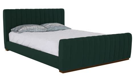 A Green Bed With Two Pillows On Top Of It And A White Blanket Over The