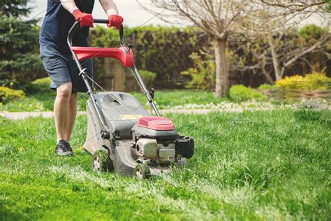 Lawn Mower Man Working On The High Quality Nature Stock Photos
