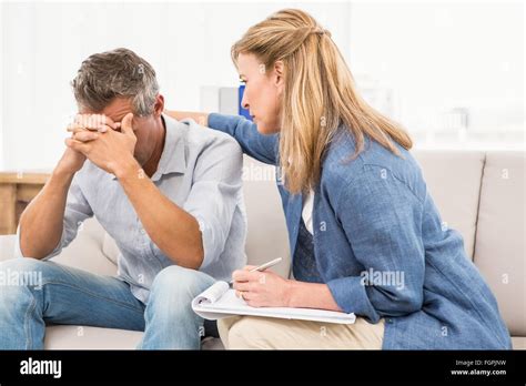 Concerned Therapist Comforting Male Patient Stock Photo Alamy