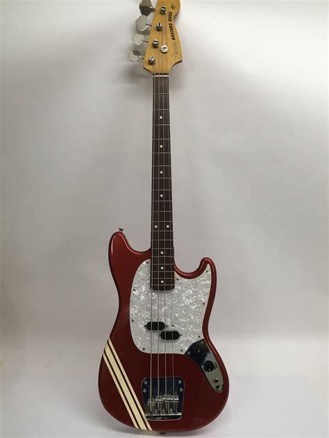 A 34 Size Japanese Fender Mustang Bass Guitar In Red With Three Stripe