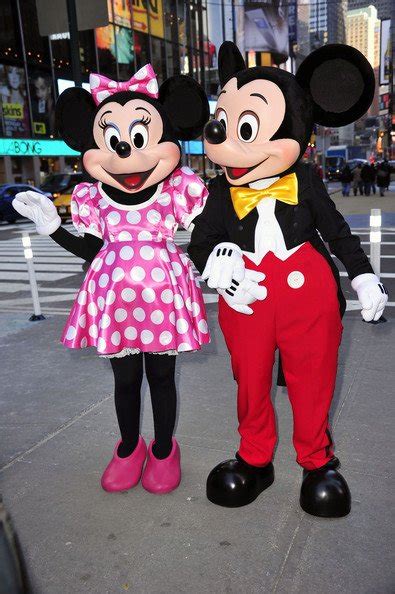 The Changing Outfits Of Minnie Mouse From Dresses To Pantsuits