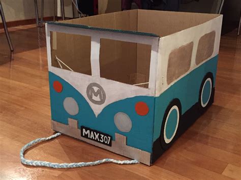 A Cardboard Box With A Blue And White Bus On It