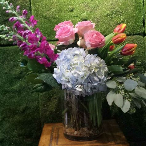 sprawling snapdragon with hydrangea roses and tulips by designer pamela morgan floral