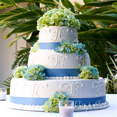 Photo Of A Wedding Cake Blue Ribbon White Green Flowers Pattys Cakes