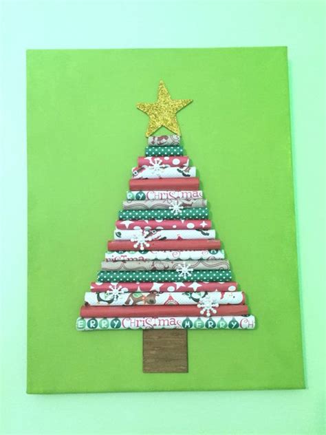 A Christmas Tree Made Out Of Wrapping Paper On Top Of A Green Board