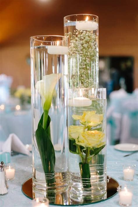Pin By Tiffany Clark On Wedding Wedding Reception Table Decorations Submerged Flowers Flower
