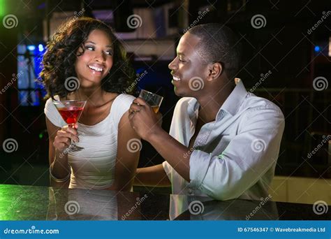 Couple Talking And Smiling While Having Drinks At Bar Counter Stock Image Image Of Beautiful
