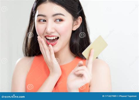Picture Showing Smart Attractive Young Asian Girl Holding Credit Card