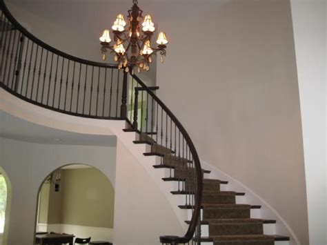 The color changes depending on the light and it looks a little different in each room. rebecca1678: foyer with staircase | Manchester tan, Manchester tan benjamin moore, Tan walls