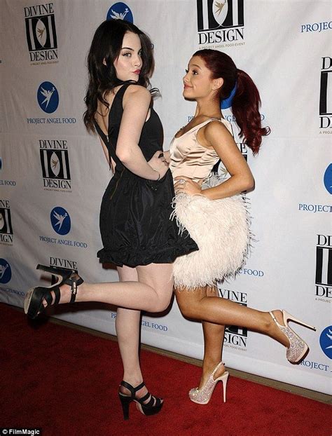 Elizabeth Gillies And Ariana Grande Touching Each Other
