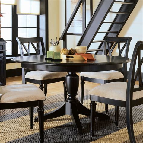 The rectangle dining table features a trestle style base, perfecting the rustic, farmhouse style. Square vs Round Kitchen Tables: What to Choose? - Traba Homes