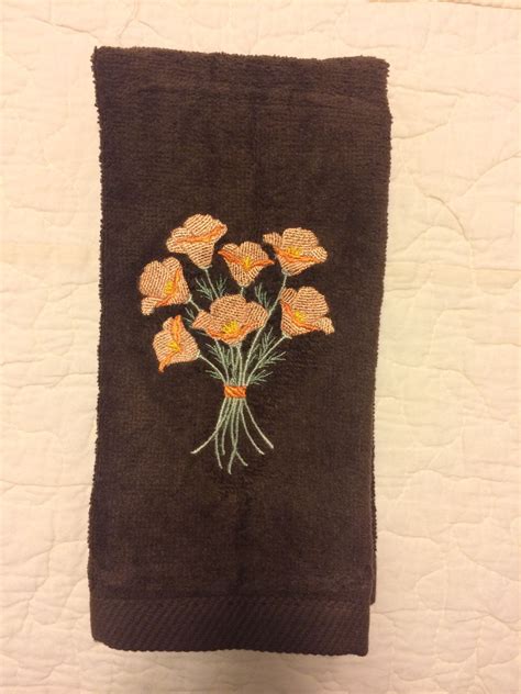 Give your bath a designer look by filling a punchbowl, box, or platter with a set of hand towels or washcloths. Bathroom towel, machine embroidered. Embroidery design by ...