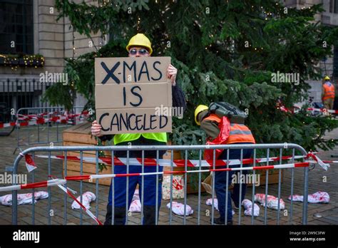 Schiedam, Netherlands. 26th Dec, 2023. An activist holds a sign reading