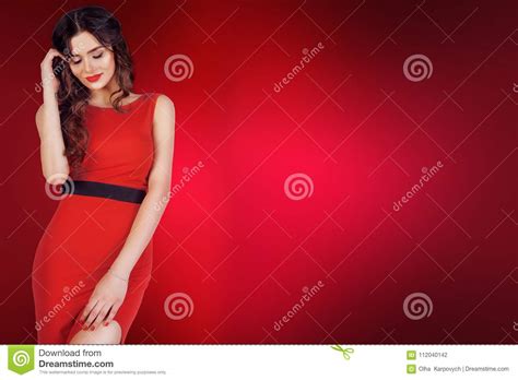 Sensual Beautiful Brunette Woman Posing In Red Evening Dress Girl With Long Curly Hair Big Red