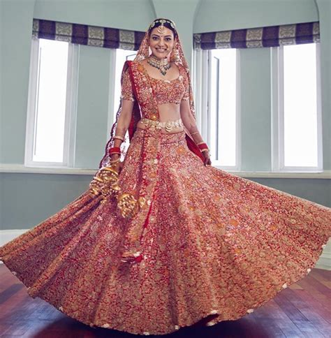 Kajal Aggarwals Red Anamika Khanna Bridal Lehenga Featured Stunning