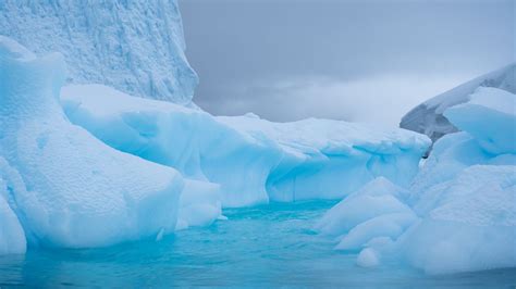 Download Wallpaper 1366x768 Glacier Ice Water Antarctic Snow Tablet