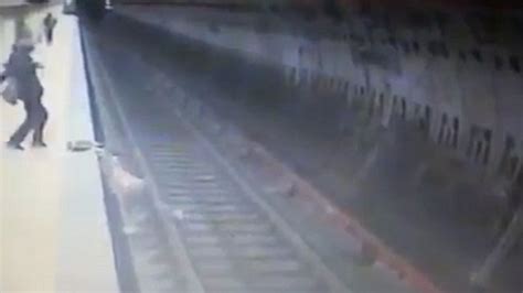 Watch Cctv Captures Moment Woman Pushed Onto Train Tracks To Die