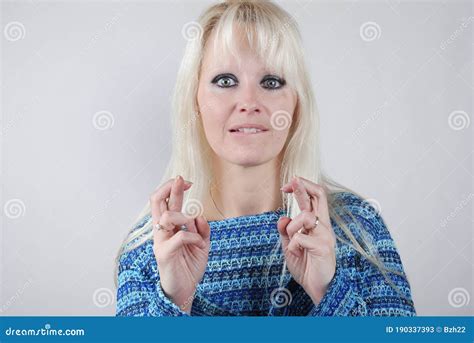Young Blond Woman Fingers Crossed Stock Image Image Of Hope