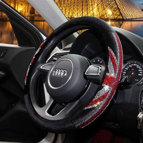 The Steering Wheel Cover Is Decorated With Red White And Black Designs