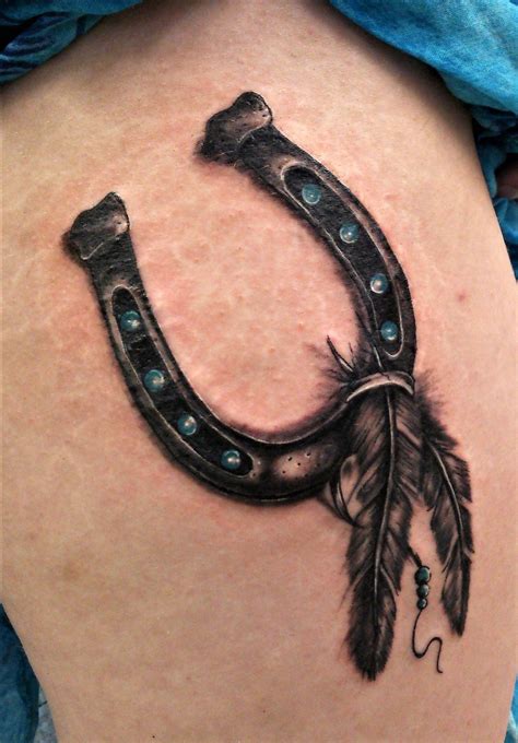 Favorite add to traditional wholesome country tattoo flash woodtattooco. Custom horseshoe tattoo with feathers thigh tattoo by Dave ...