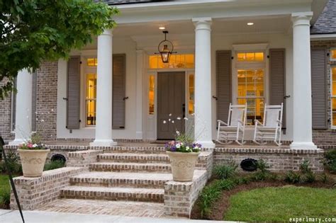 Inspirational front door entrance ideas, including outdoor lighting, landscaping, water features, double front doors, and contemporary pivot front door designs. Front Porch Lighting Ideas