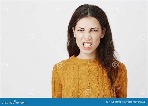 Close Up Portrait Of Irritated Mad European Woman Grinning And