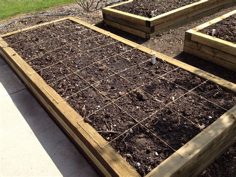 How to plan, plant and maintain a square foot garden by build boxes and grids. Dave measures and lays out the square foot grids for the ...