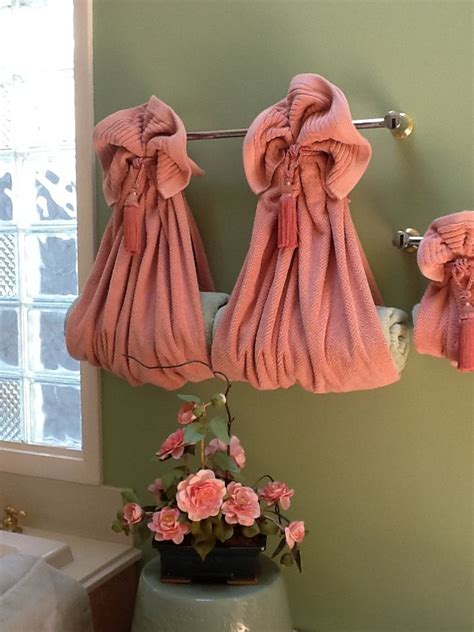 You can keep open shelves in your toilet. Decorative towels for the bathroom | Bathroom towel decor ...