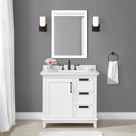A White Bathroom Vanity With Two Sinks And A Large Mirror Over The Sink