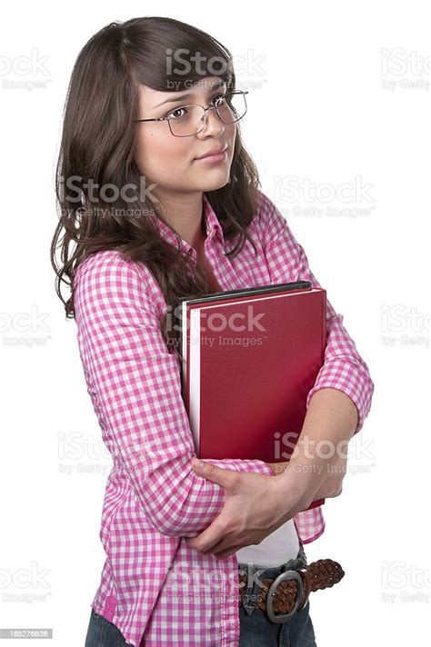 Beautiful And Serious High School Student Holding Books Stock Photo
