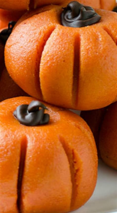 Some Oranges Are Stacked On Top Of Each Other And Have Black Chocolate