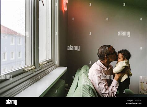 Father Kissing Baby Daughter Stock Photo Alamy
